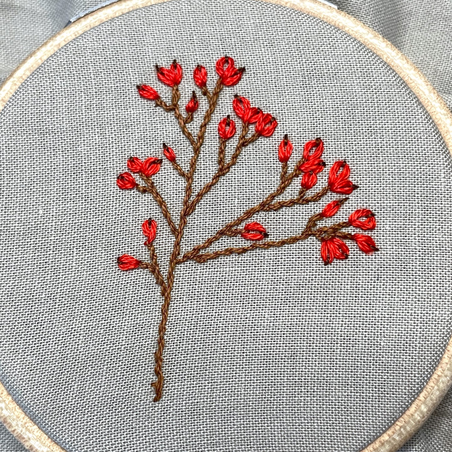 Rose hips embroidered with lazy daisy stitch