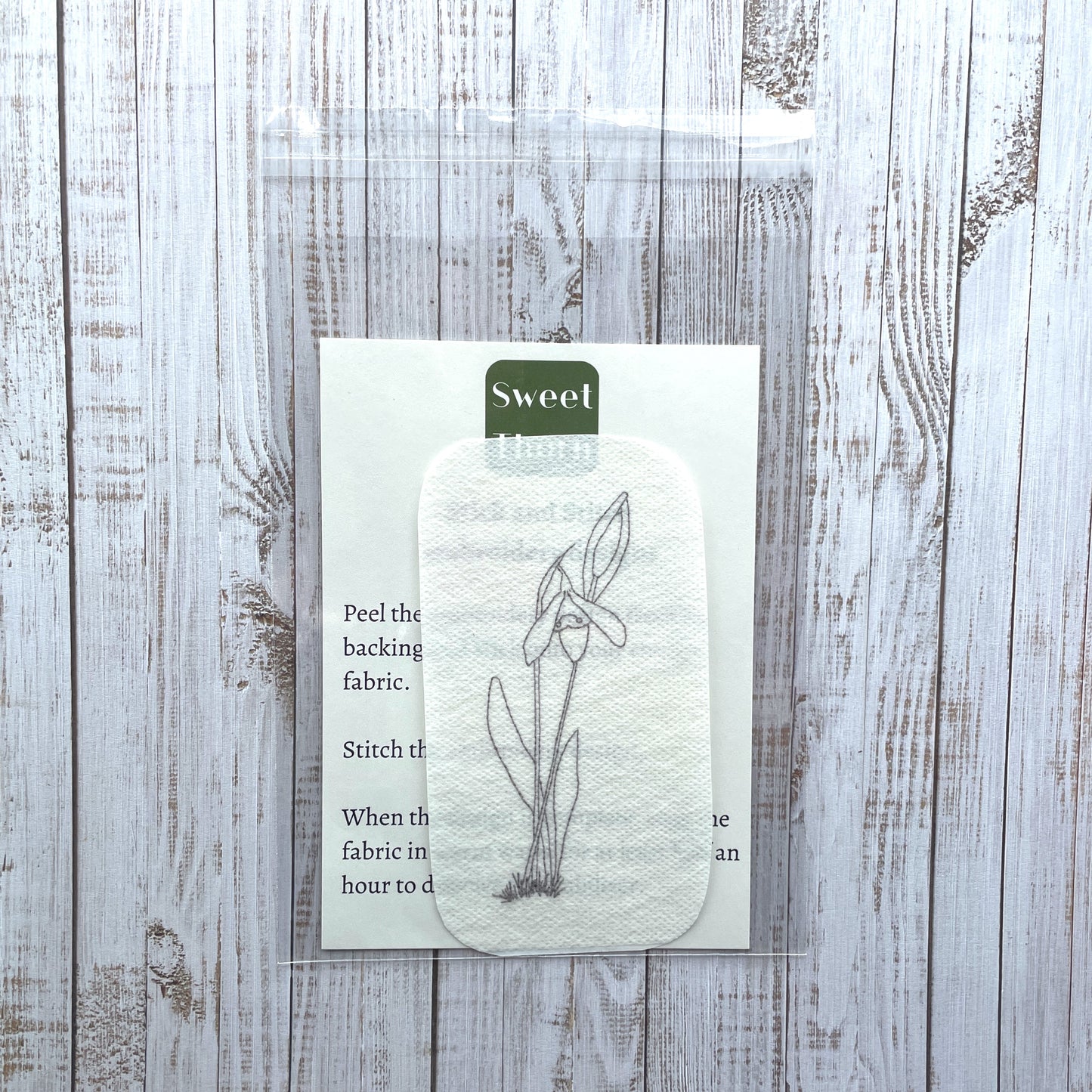 snowdrop embroidery sticker in cellophane bag with instruction card.