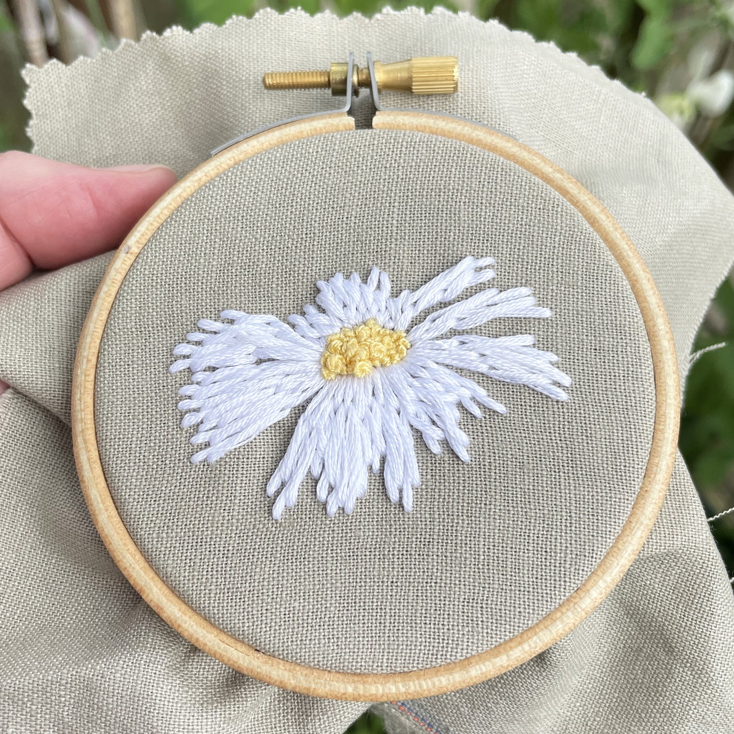 Hand embroidered ox eye daisy head in a 3 inch hoop